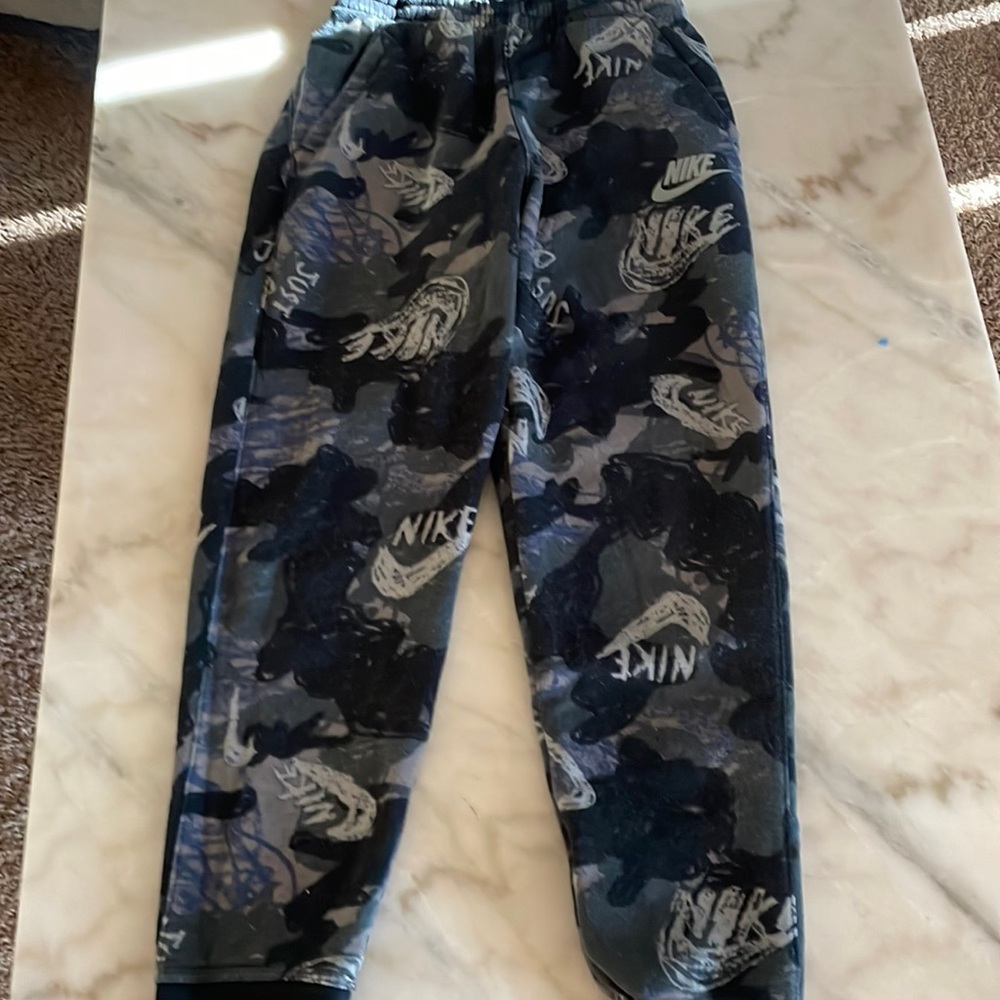 Nike- color: black and grey, size: large, condition: used.